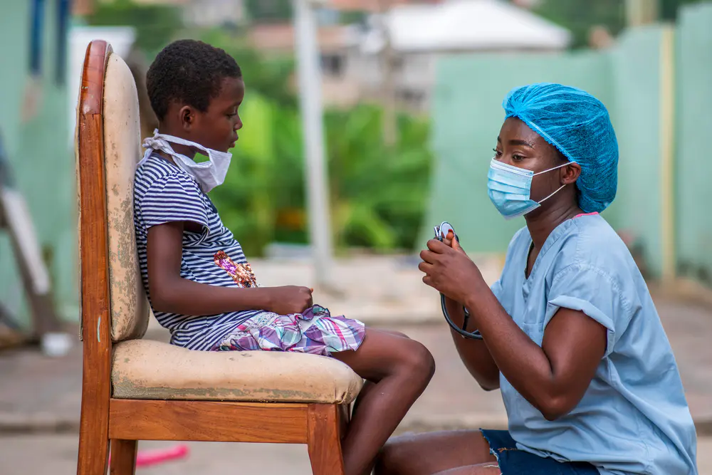 a doctor attending to a child
