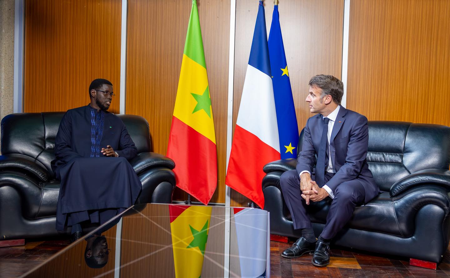 Bassirou Diomaye Faye and Emmanuel Macron shaking hands