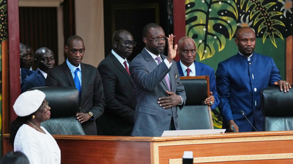 Ousmane Sonko, center, arrives to deliver a speech following his election as President of the National Assembly, Tuesday, May 26, 2026, in Dakar.