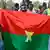 Supporters of the AES wave a handmade Burkina Faso flag (January 2024 archive)