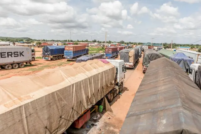 Long queues of trucks stranded at the closed Benin-Niger border near Malanville