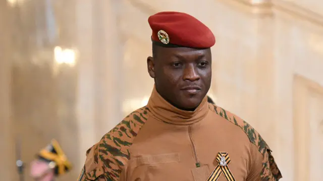 Burkina Faso's military leader Ibrahim Traore in military uniform with red cap