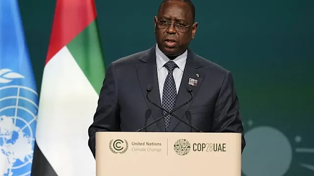 former Senegal president Macky Sall shaking hands with current President Bassirou Diomaye Faye