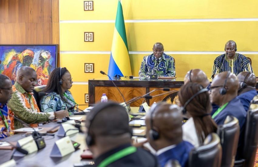 Diplomatic handshake between Gabonese and Ghanaian officials